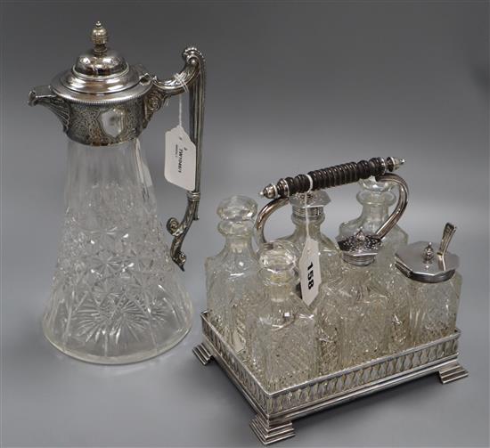 A cut glass claret jug with silver-plated mounts and a six-bottle plated cruet set